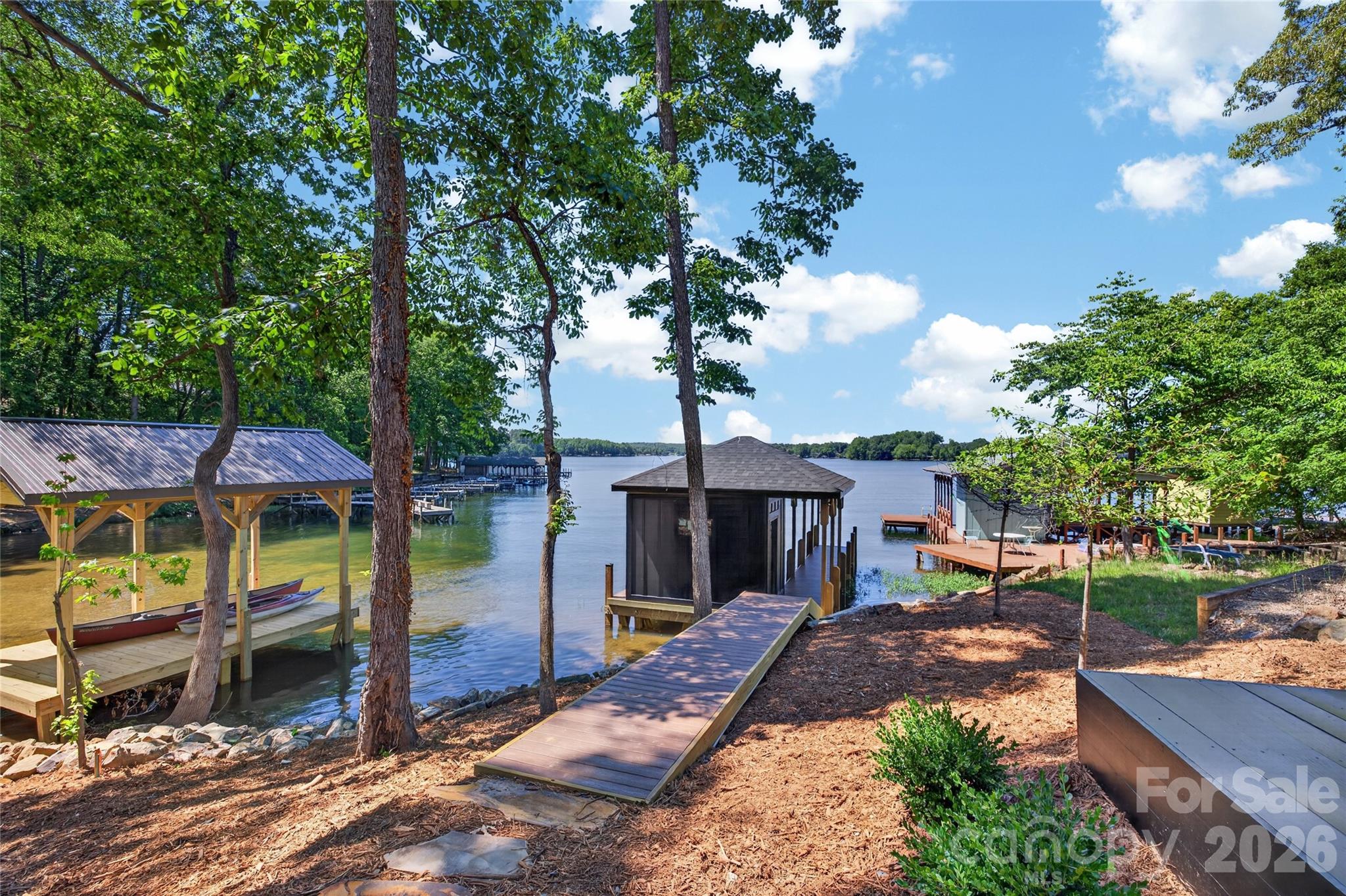 115 High Shores Road Norwood, NC 28128 - Photo 27 of 30 a view of a house with a yard and sitting area
