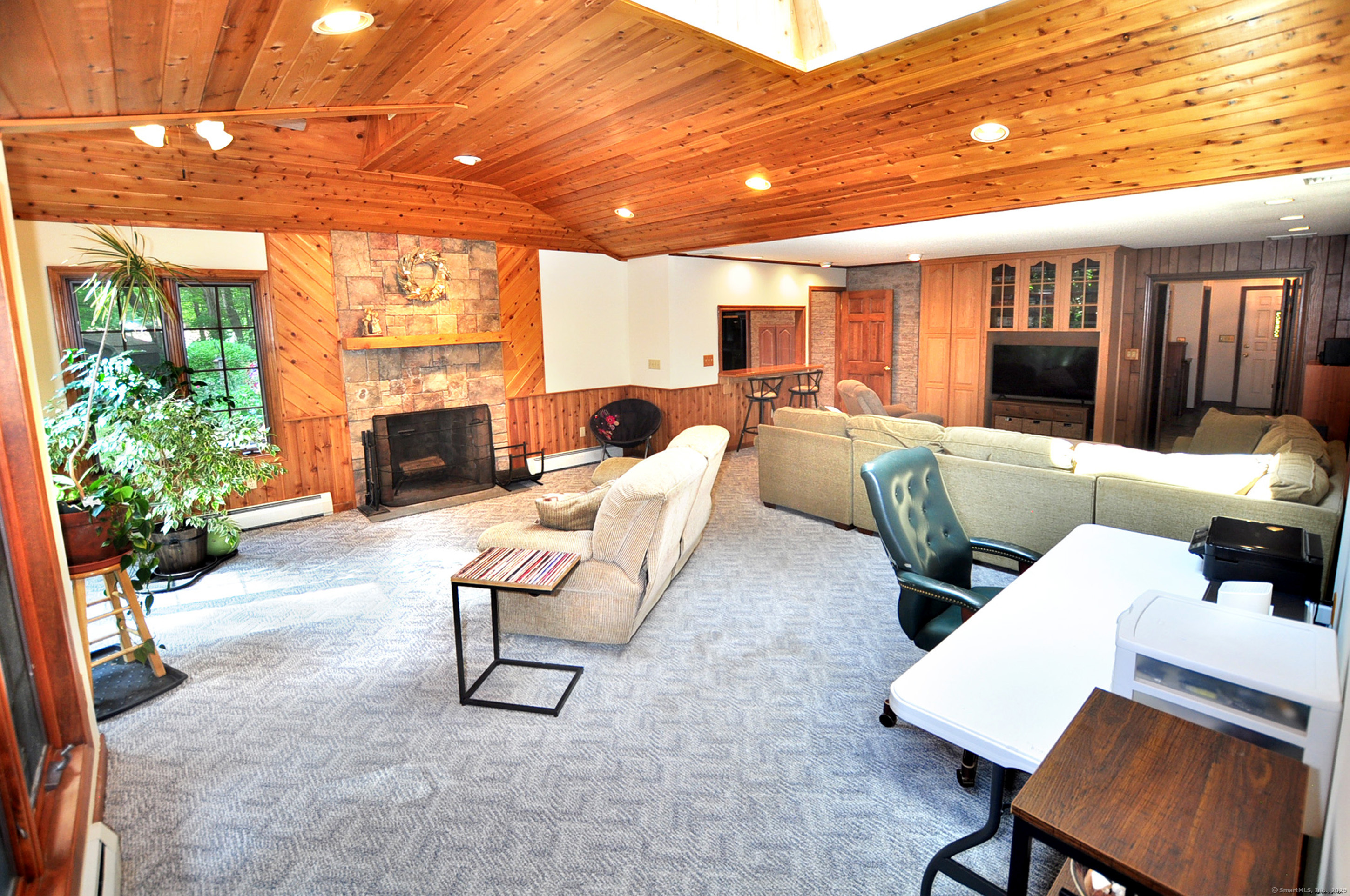 18 Fiano Road Bolton, CT 06043 - Photo 19 of 38 a living room with furniture and a fireplace