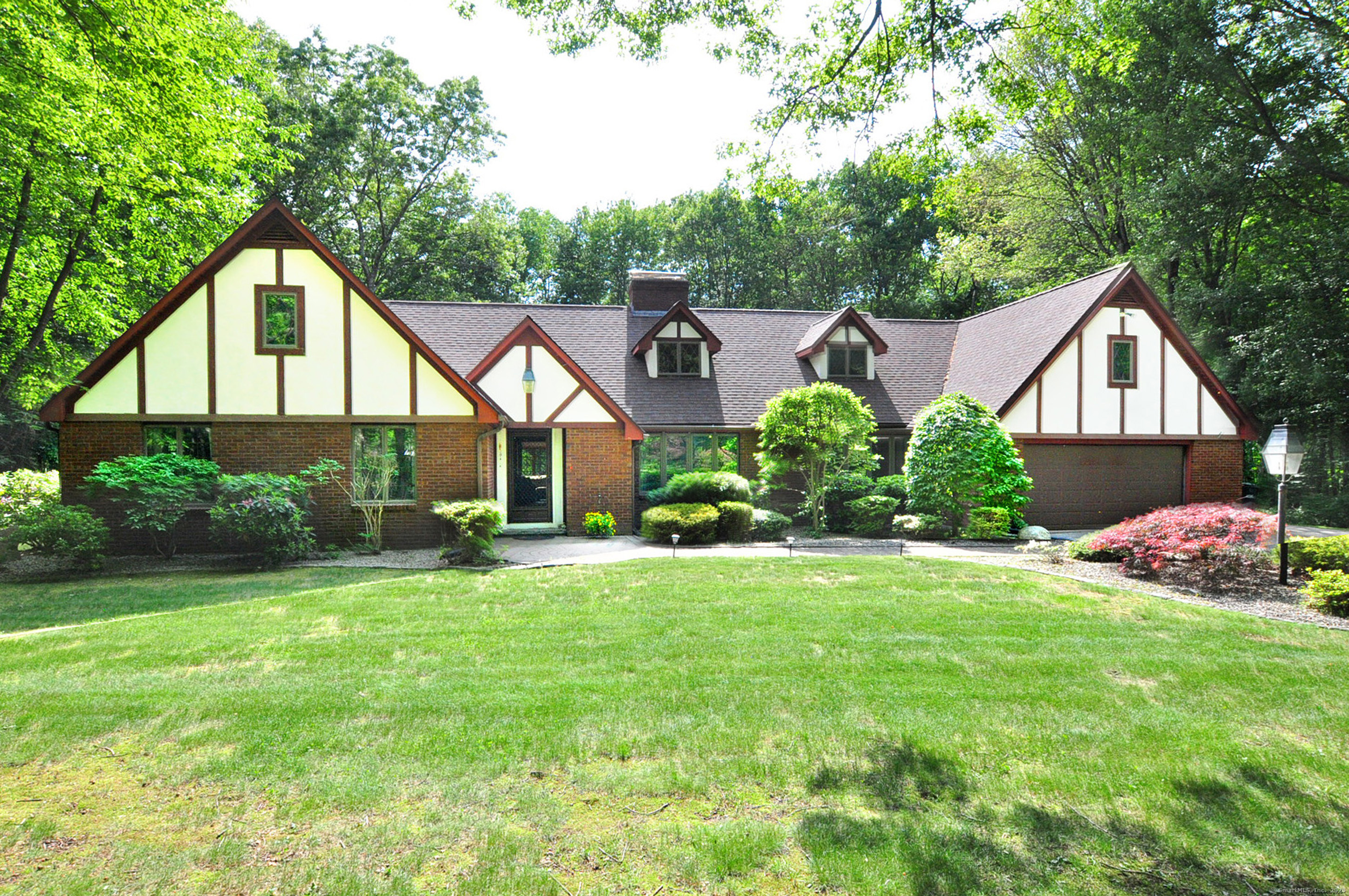 18 Fiano Road Bolton, CT 06043 - Photo 2 of 38 a front view of house with yard and green space