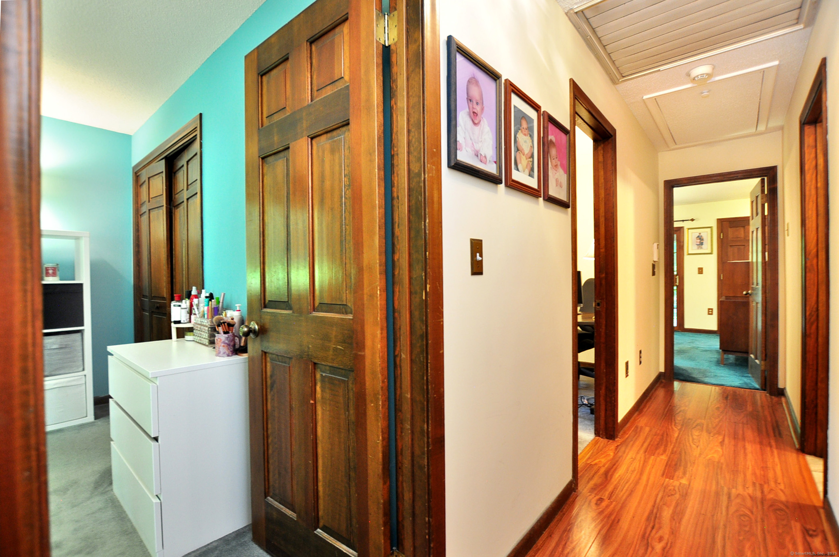 18 Fiano Road Bolton, CT 06043 - Photo 26 of 38 a hallway with a sink and wooden floor