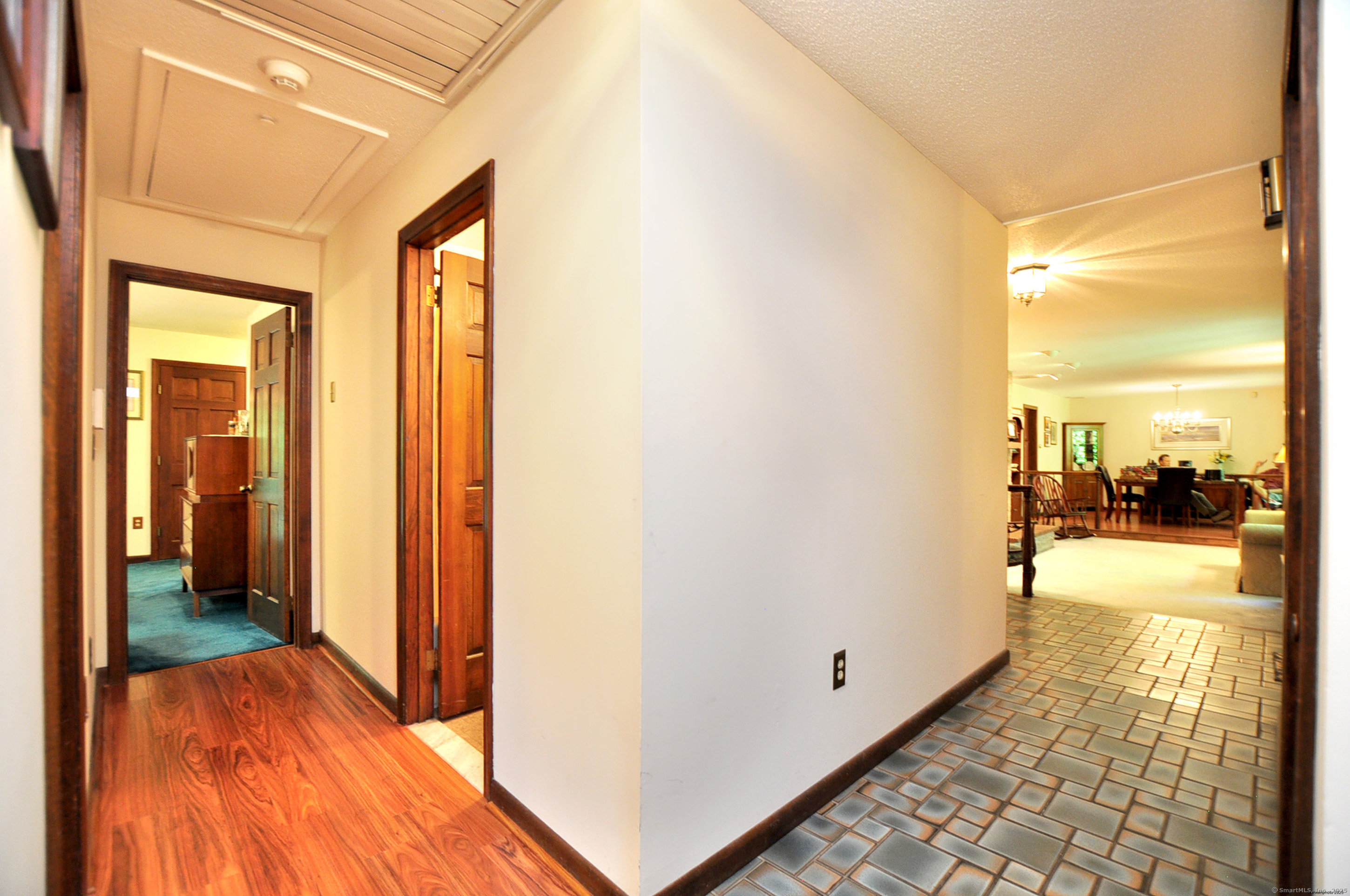 18 Fiano Road Bolton, CT 06043 - Photo 27 of 38 a view of a hallway with wooden floor and a bathroom