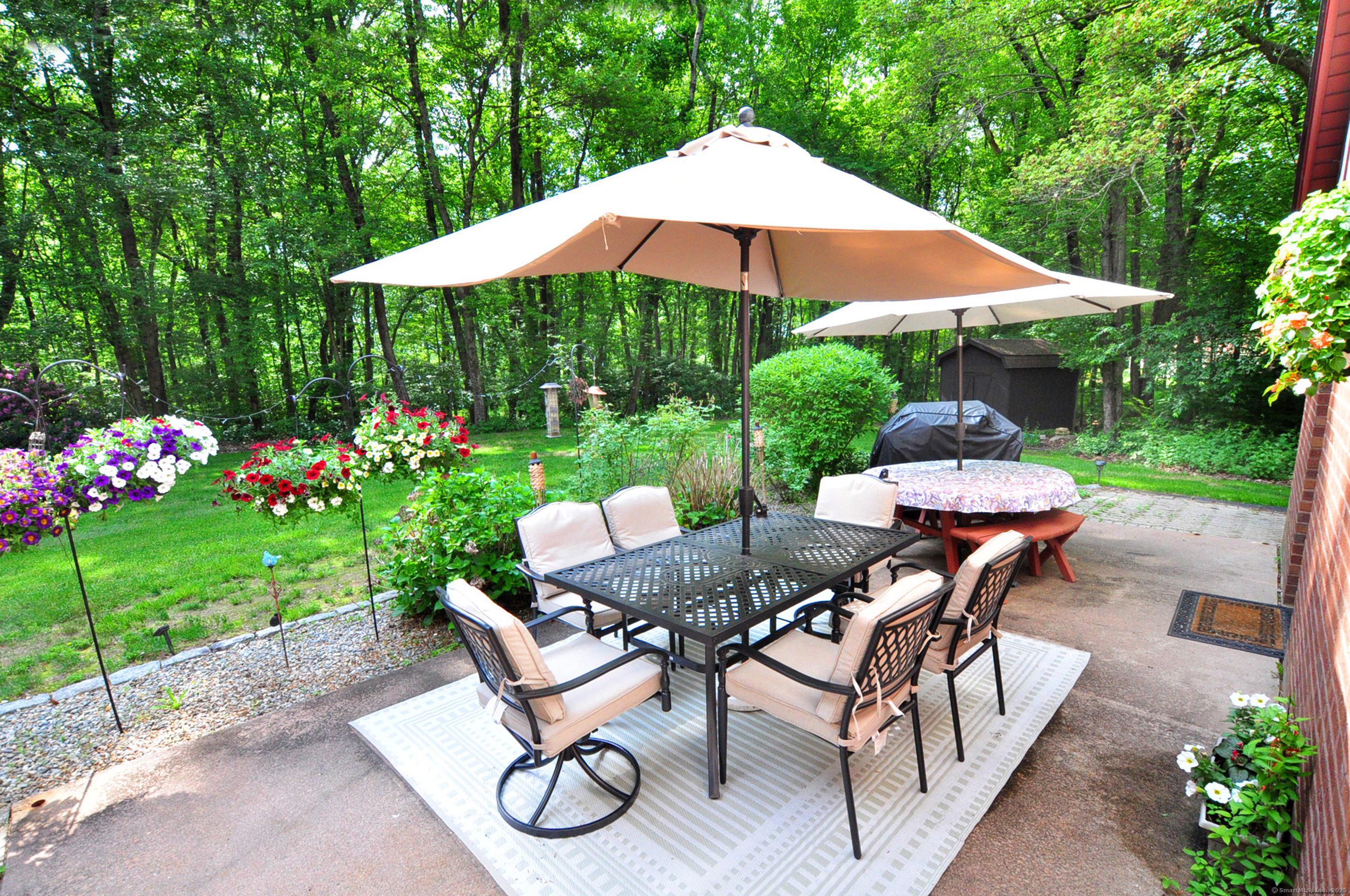 18 Fiano Road Bolton, CT 06043 - Photo 37 of 38 a patio with a patio table and chairs