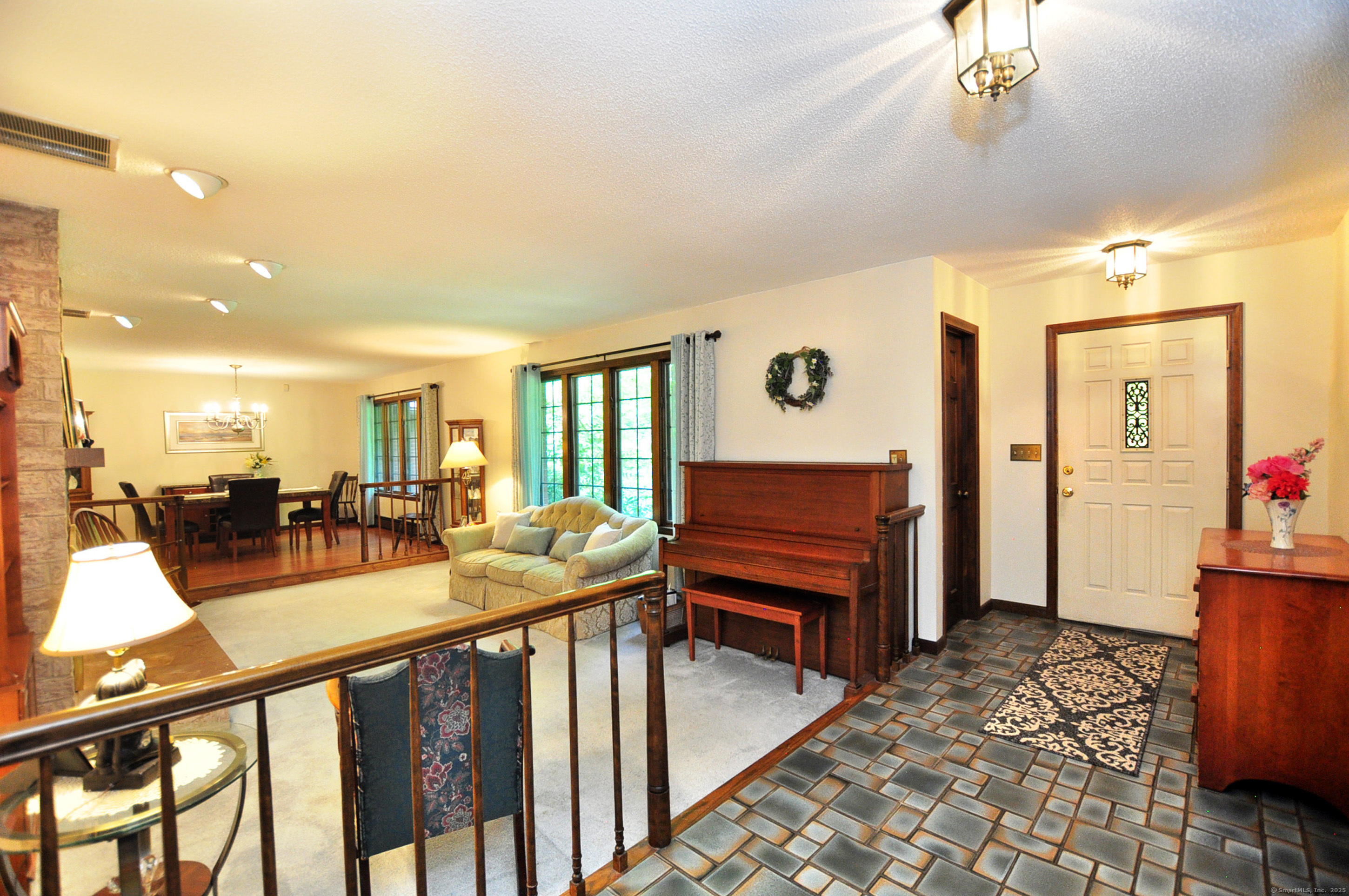 18 Fiano Road Bolton, CT 06043 - Photo 5 of 38 a view of a livingroom with furniture and a flat screen tv