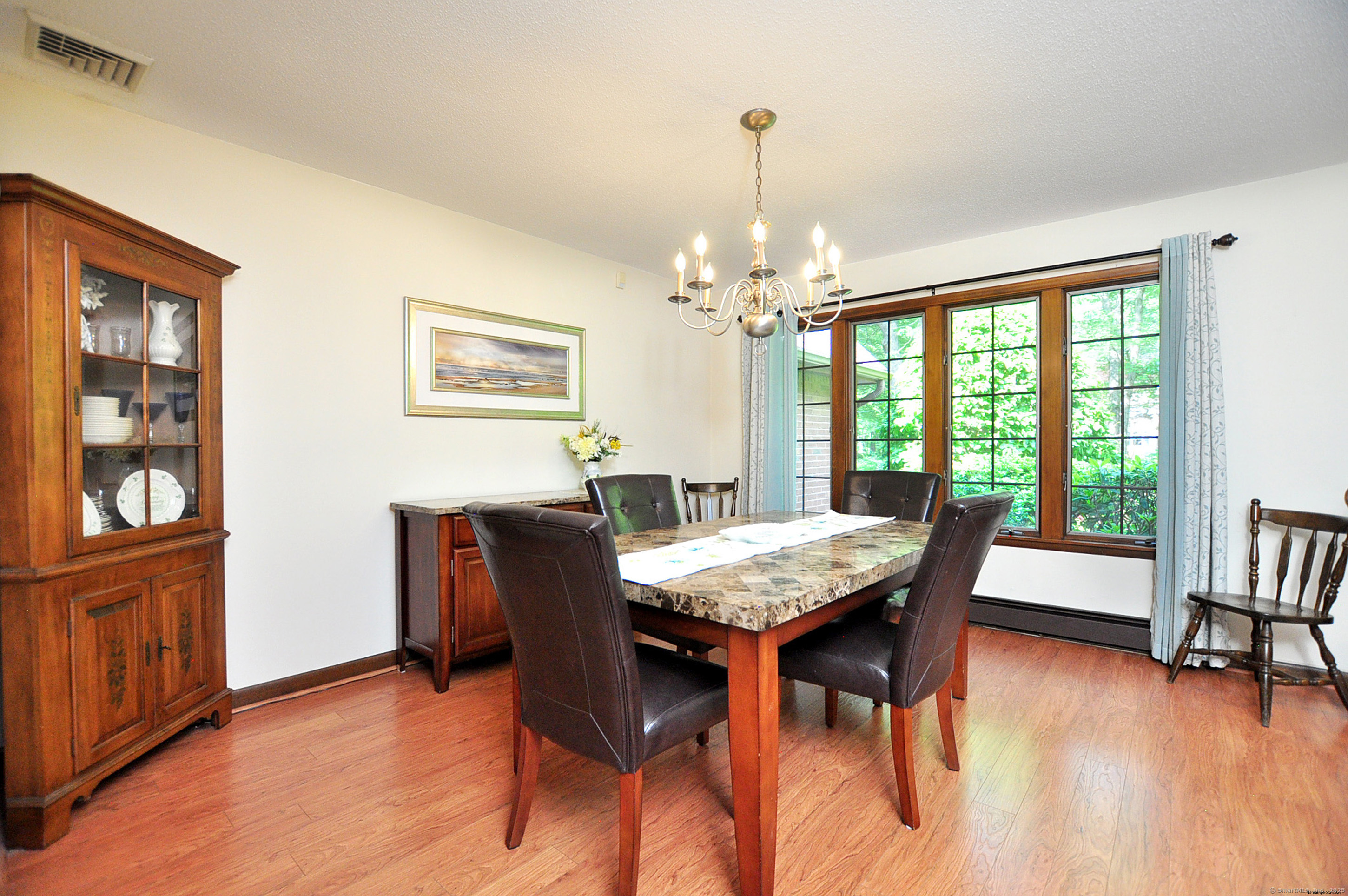 18 Fiano Road Bolton, CT 06043 - Photo 8 of 38 a view of a dining room with furniture window and wooden floor
