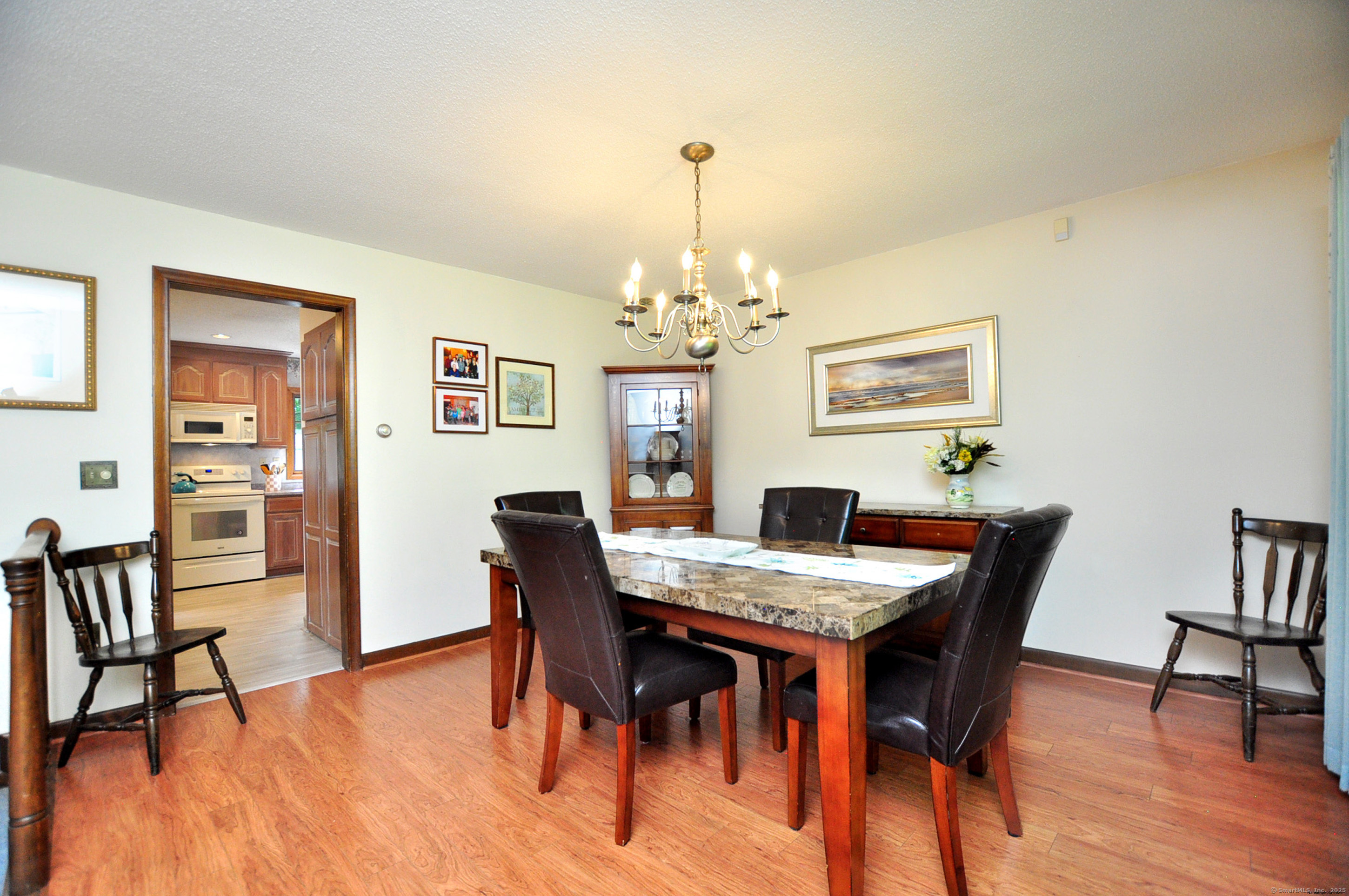 18 Fiano Road Bolton, CT 06043 - Photo 9 of 38 a view of a dining room with furniture window and wooden floor