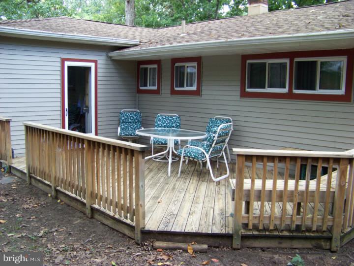 327 Evergreen Road Mount Laurel, NJ 08054 - Photo 15 of 17 a roof deck with a table and chairs