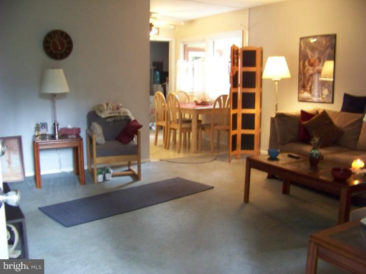 327 Evergreen Road Mount Laurel, NJ 08054 - Photo 7 of 17 a living room with furniture and a lamp