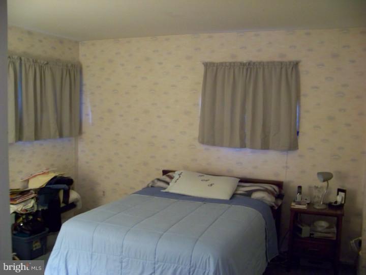 327 Evergreen Road Mount Laurel, NJ 08054 - Photo 10 of 17 a bedroom with a bed and a cabinets