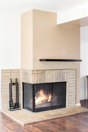 a view of a fireplace with wooden floor