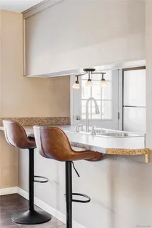 a view of a kitchen with granite countertop counter top space and a window