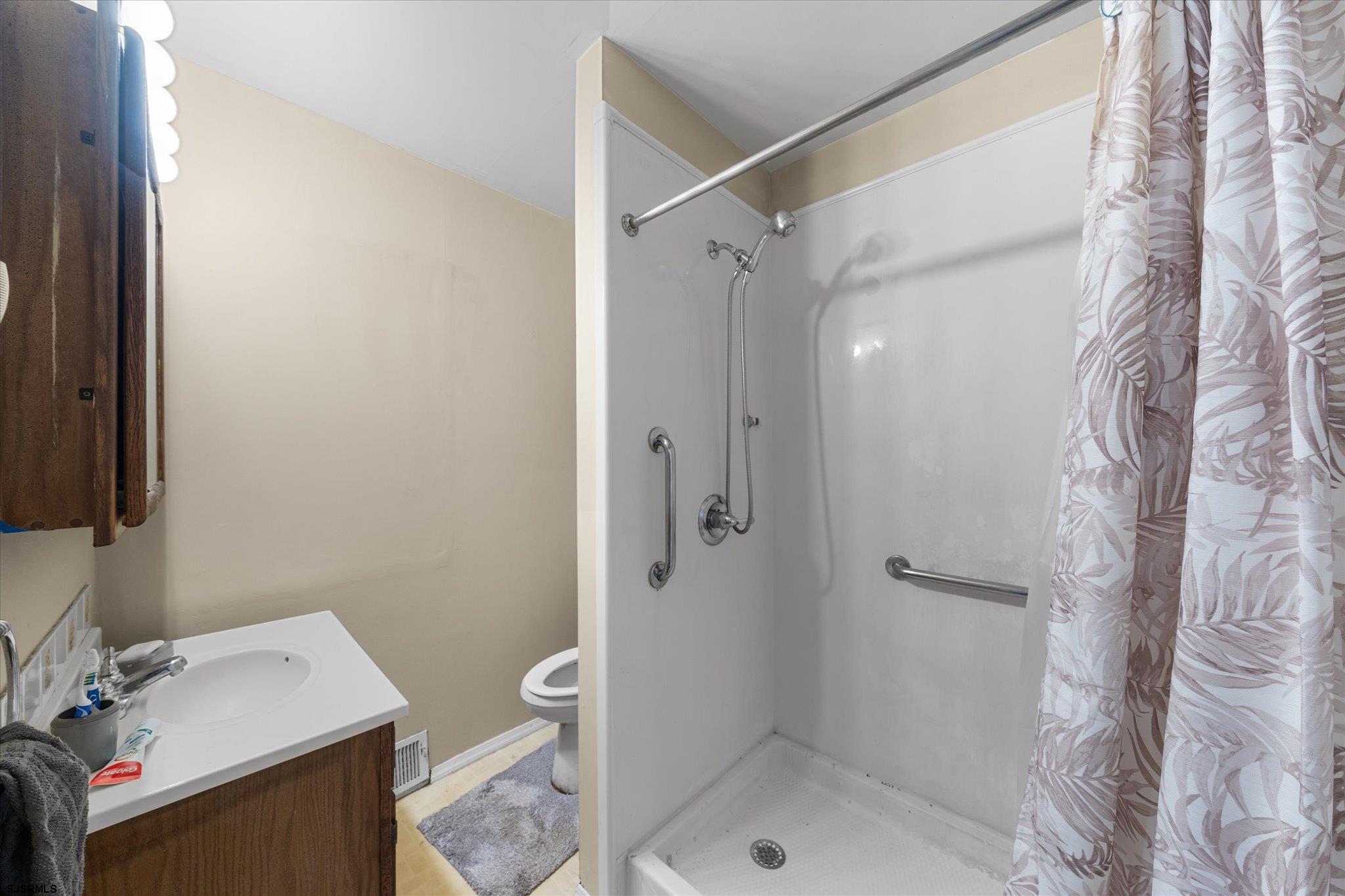 308 Pine Street Absecon, NJ 08201 - Photo 18 of 35 a bathroom with a sink toilet and shower