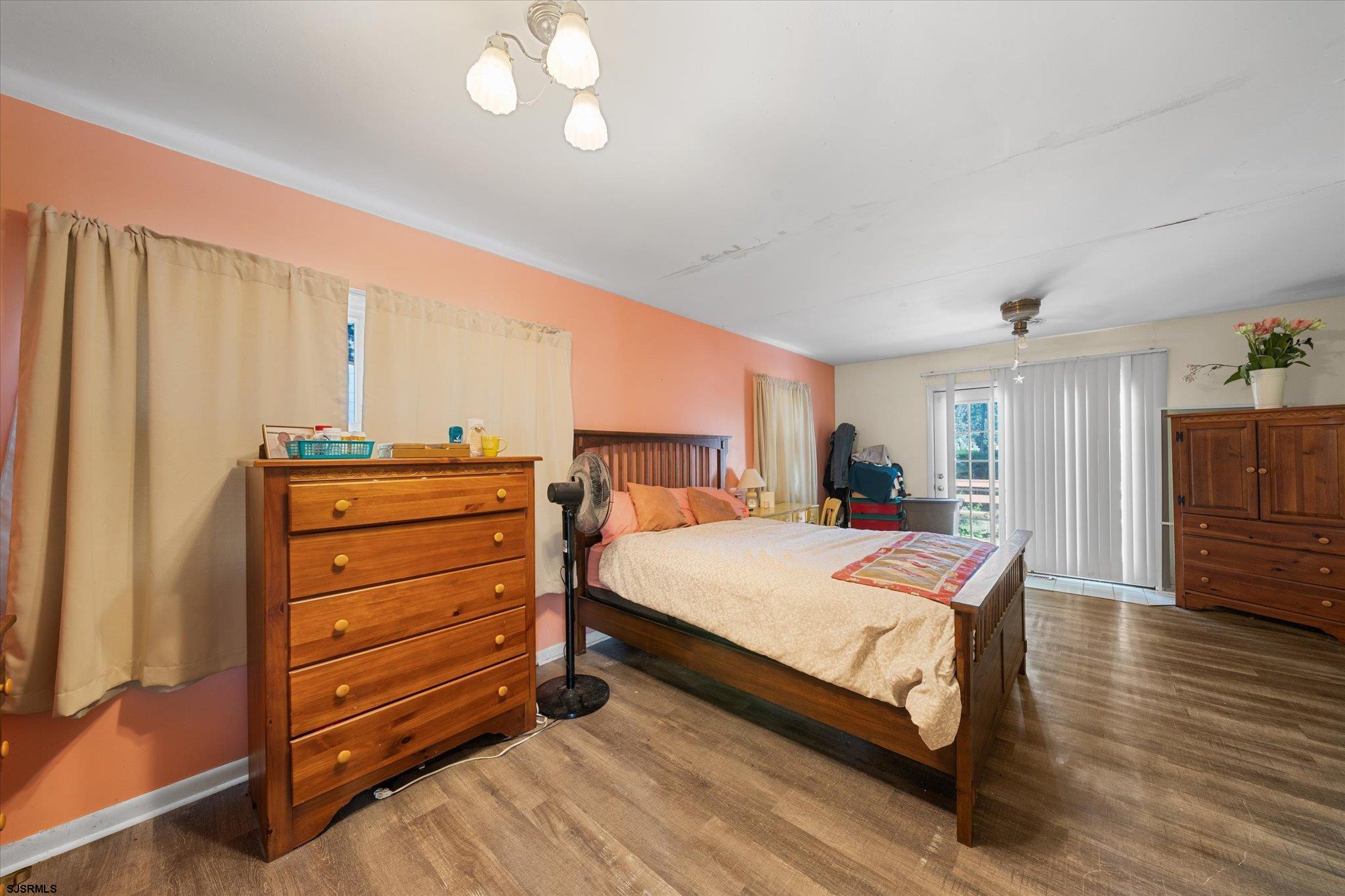 308 Pine Street Absecon, NJ 08201 - Photo 20 of 35 a bedroom with a bed and wooden floor