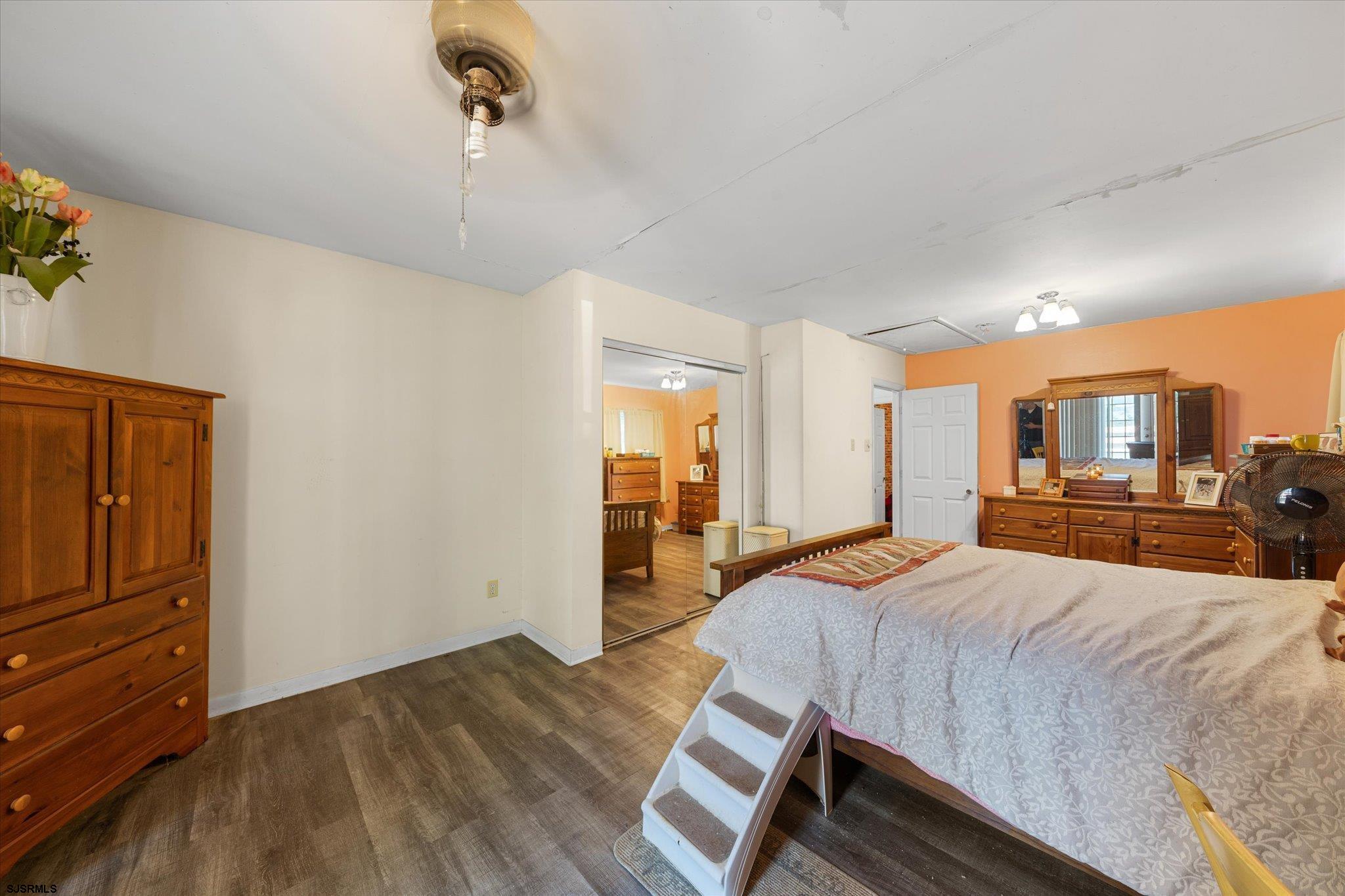 308 Pine Street Absecon, NJ 08201 - Photo 21 of 35 a bedroom with a bed and wooden floor
