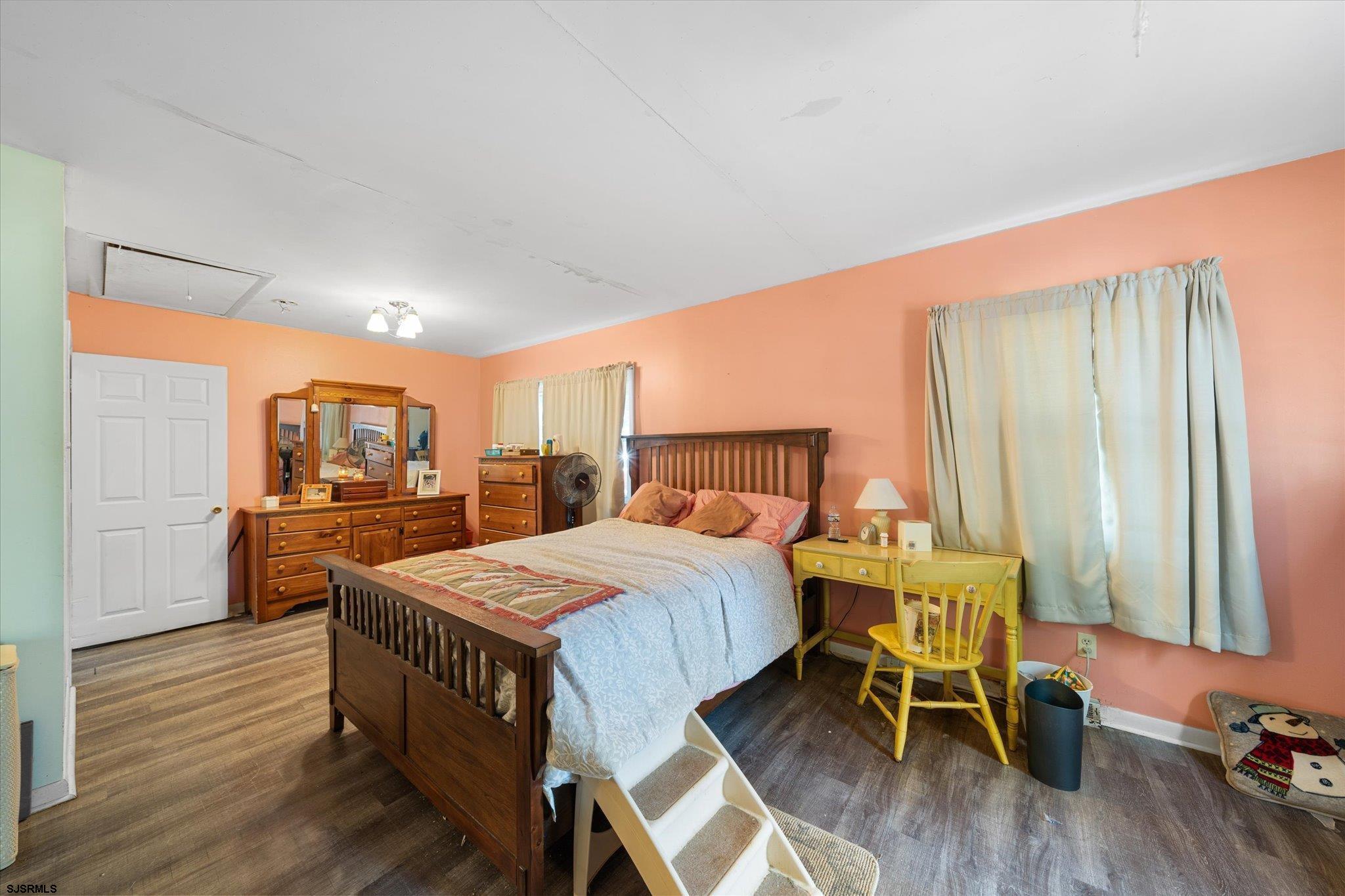 308 Pine Street Absecon, NJ 08201 - Photo 22 of 35 a living room with a bed and furniture with wooden floor