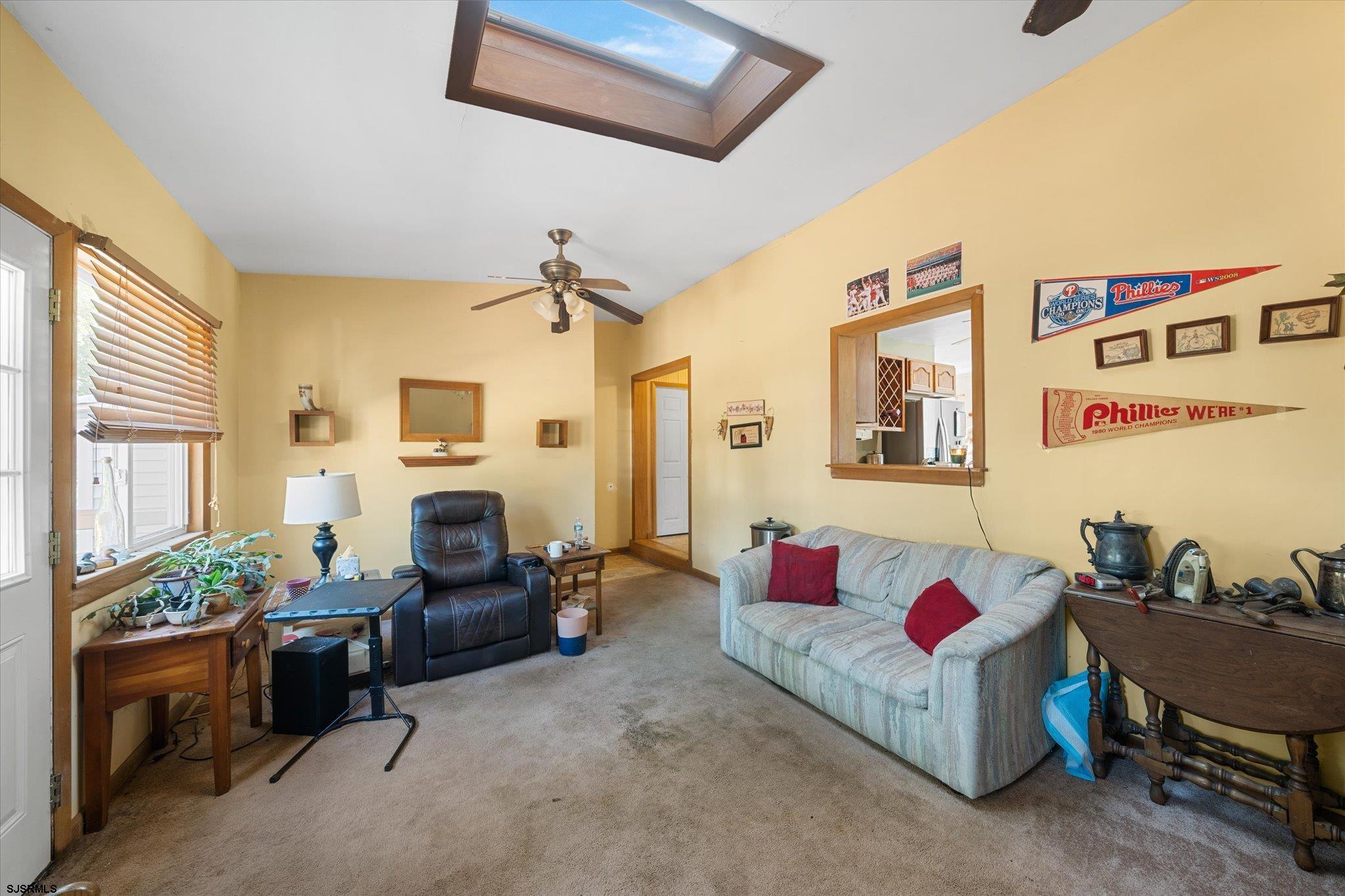 308 Pine Street Absecon, NJ 08201 - Photo 25 of 35 a living room with furniture fireplace and a window