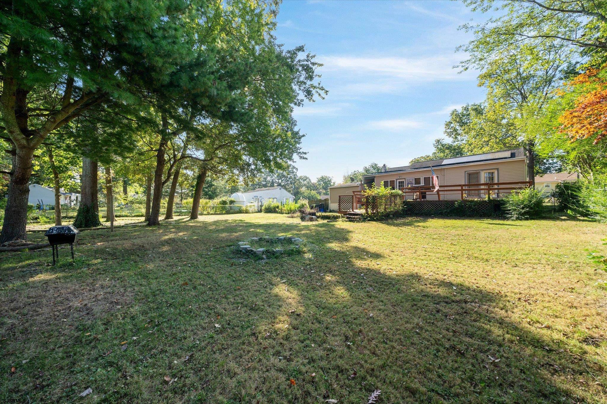 308 Pine Street Absecon, NJ 08201 - Photo 30 of 35 a view of yard with swimming pool and trees