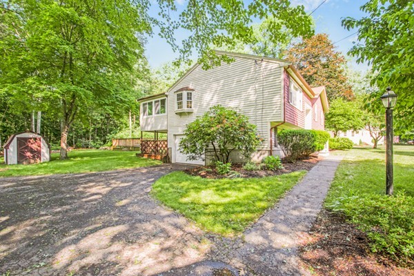 146 Mason Road Northbridge, MA 01588 - Photo 3 of 30 a front view of a house with a yard and trees