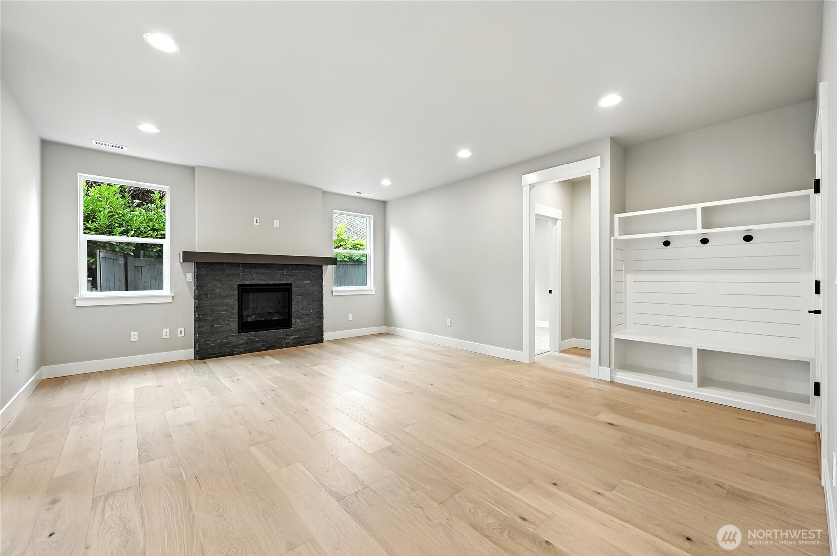 19225 Meridian Drive Southeast, Unit CW 15 Bothell, WA 98012 - Photo 11 of 31 an empty room with windows and fireplace