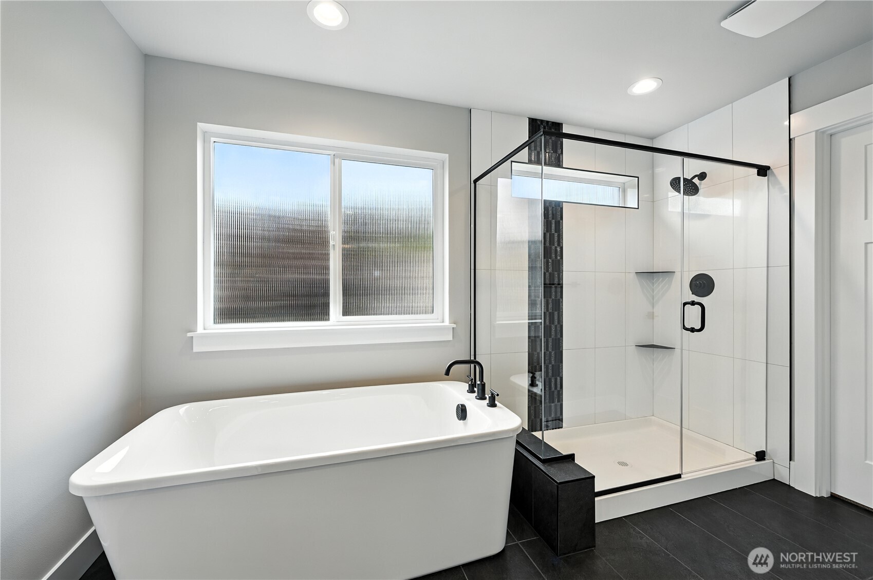 19225 Meridian Drive Southeast, Unit CW 15 Bothell, WA 98012 - Photo 20 of 31 a white bath tub sitting next to a window