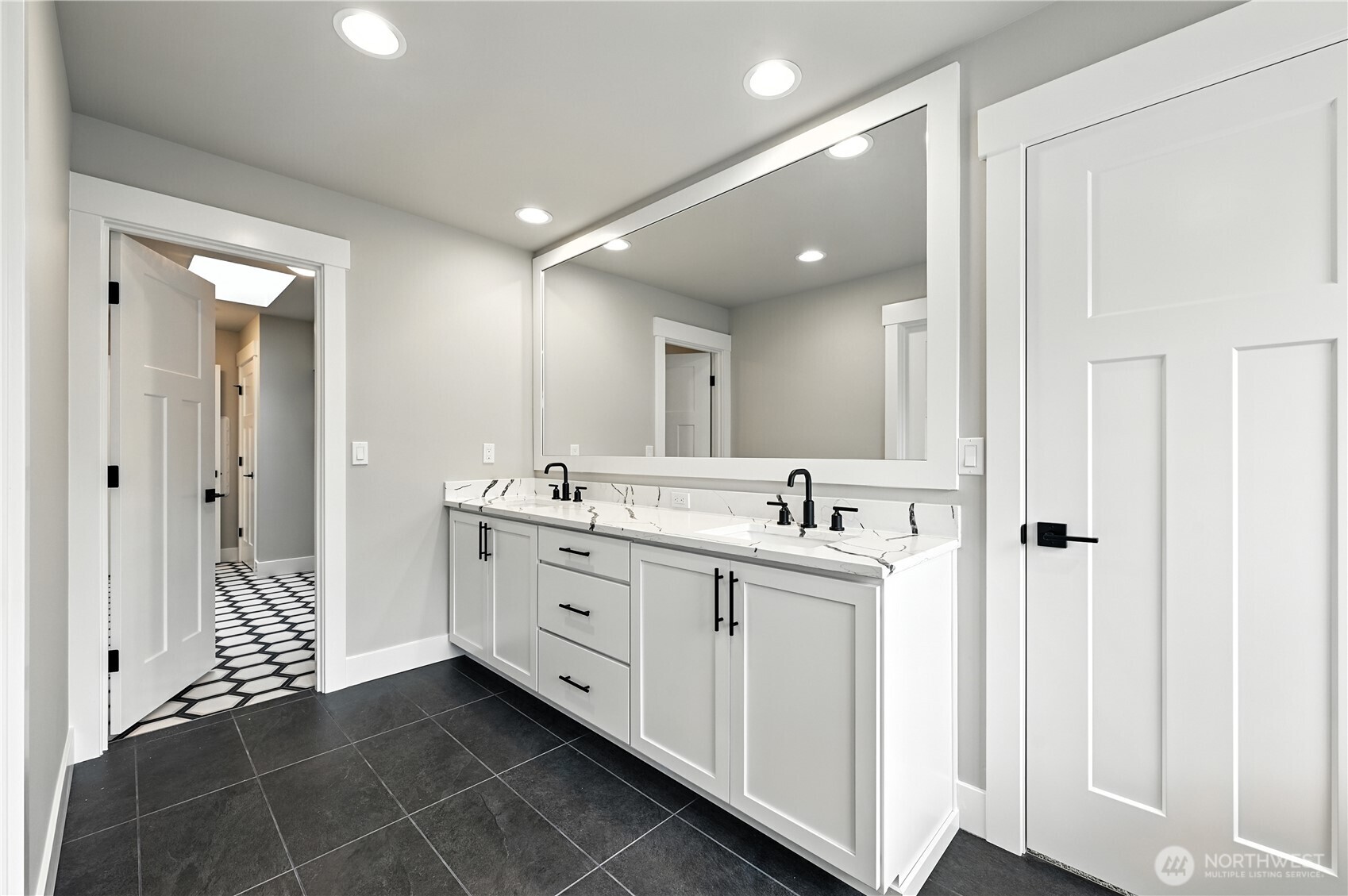 19225 Meridian Drive Southeast, Unit CW 15 Bothell, WA 98012 - Photo 21 of 31 a bathroom with a double vanity sink mirror and