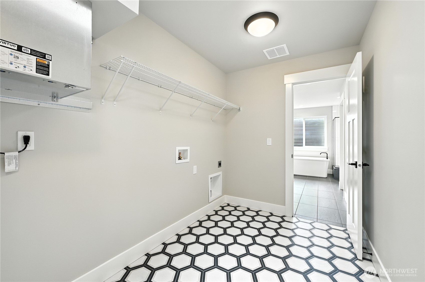 19225 Meridian Drive Southeast, Unit CW 15 Bothell, WA 98012 - Photo 22 of 31 a bedroom with a bed and a view of bathroom