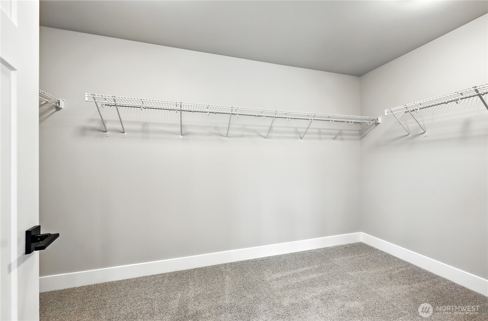 19225 Meridian Drive Southeast, Unit CW 15 Bothell, WA 98012 - Photo 24 of 31 a view of a room with racks on the wall