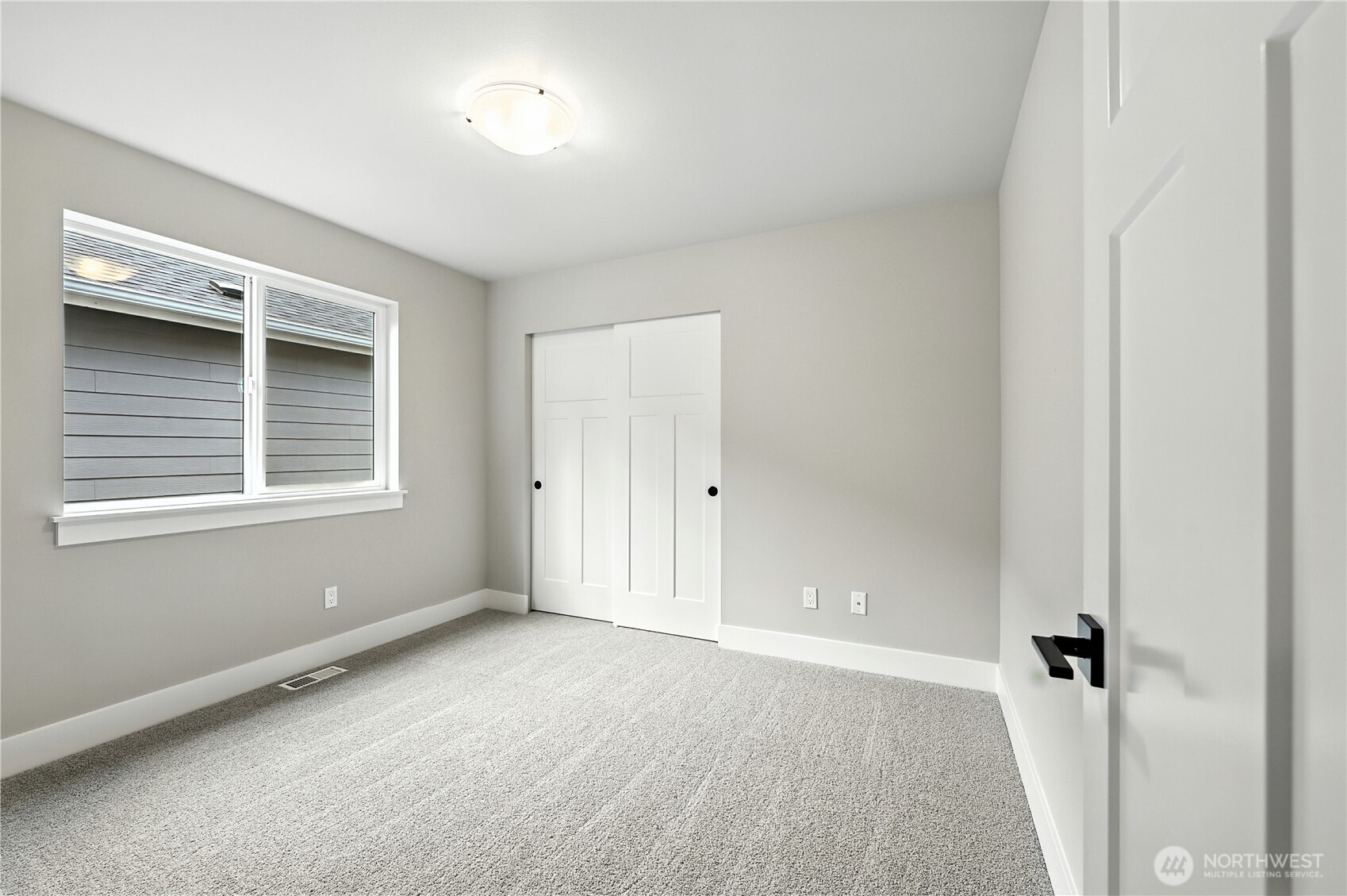 19225 Meridian Drive Southeast, Unit CW 15 Bothell, WA 98012 - Photo 26 of 31 a view of an empty room with a window