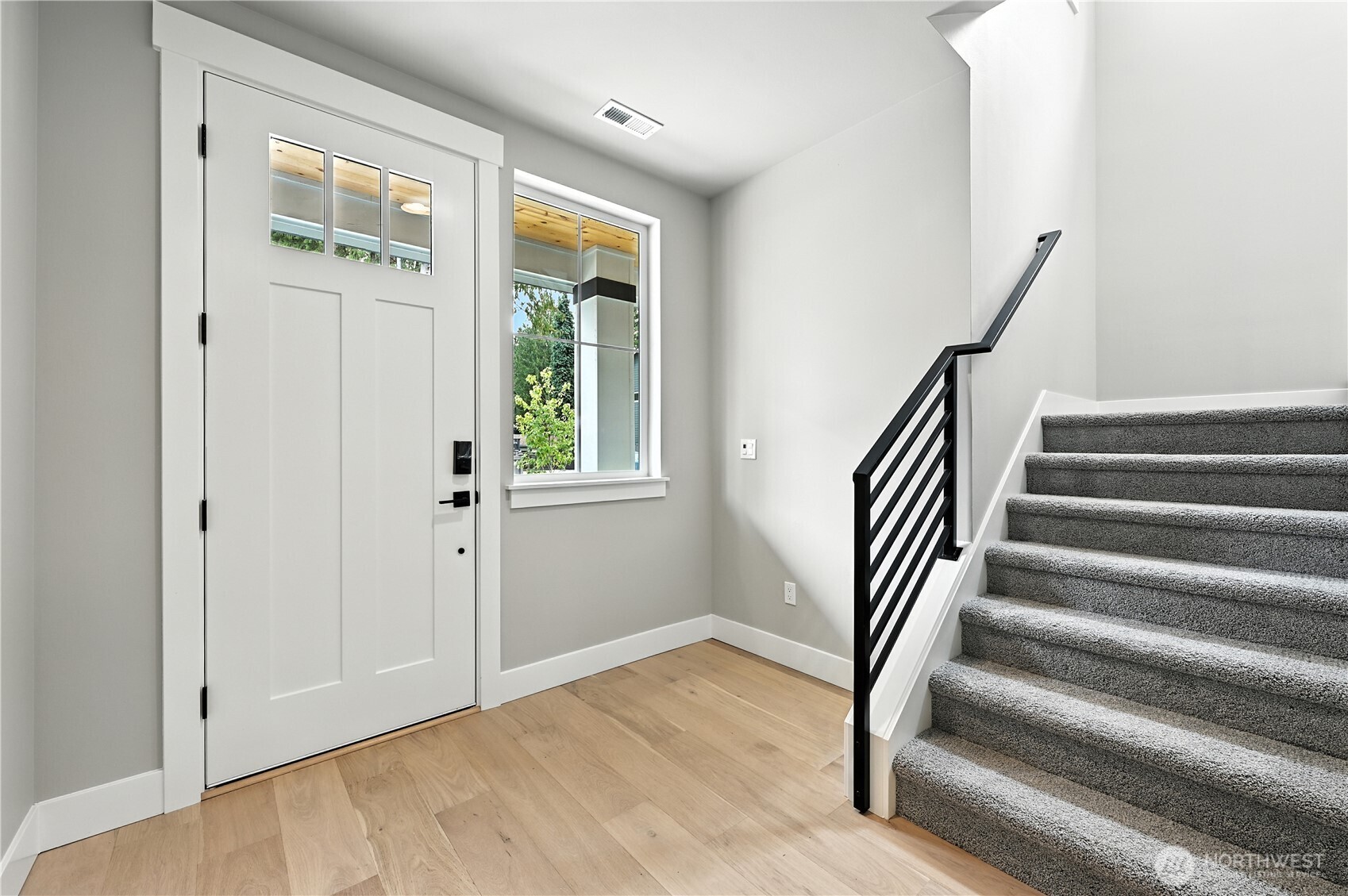 19225 Meridian Drive Southeast, Unit CW 15 Bothell, WA 98012 - Photo 3 of 31 a view of entryway with wooden floor and stairs