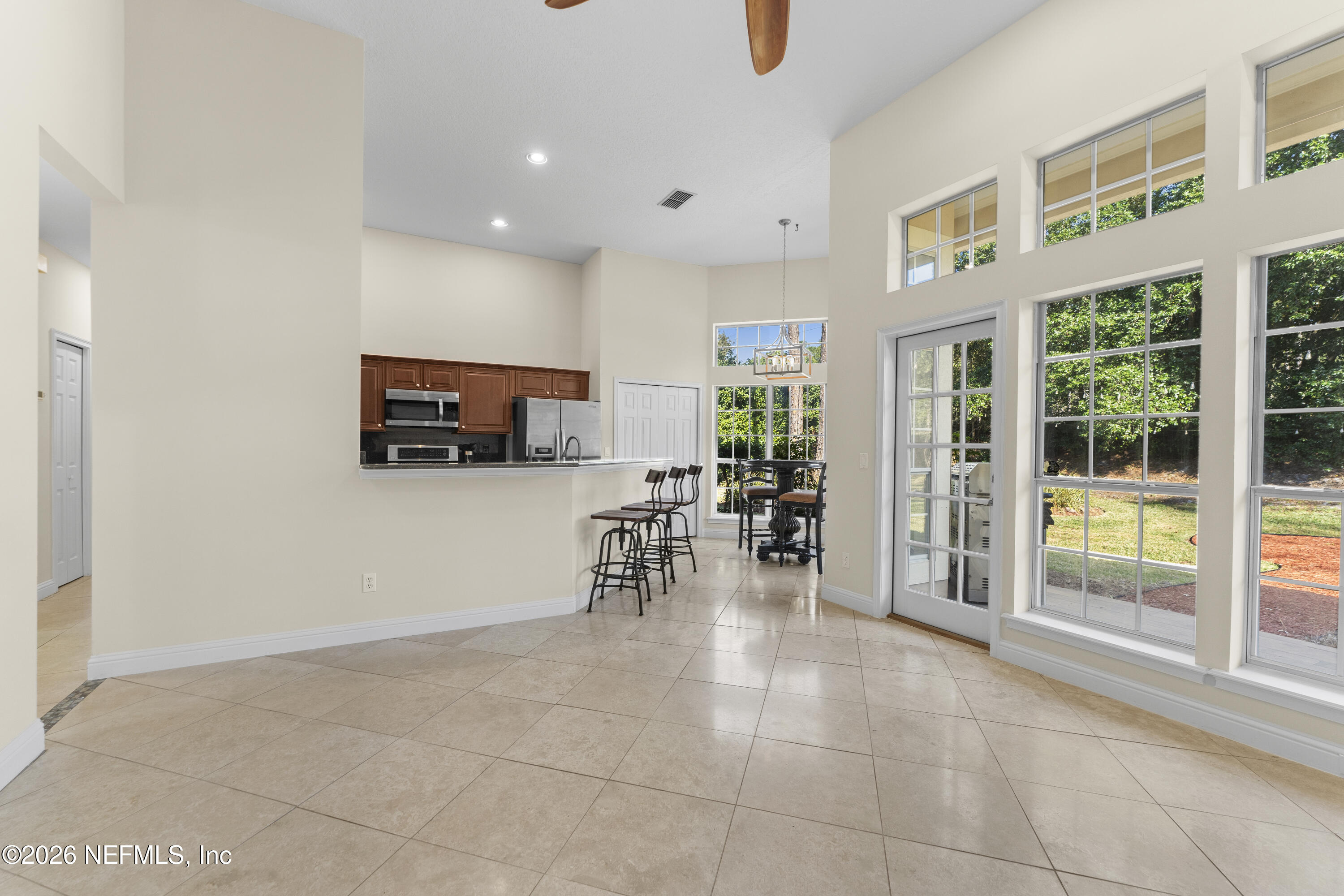 9957 Chelsea Lake Road Jacksonville, FL 32256 - Photo 13 of 73 a view of a living room and dining room