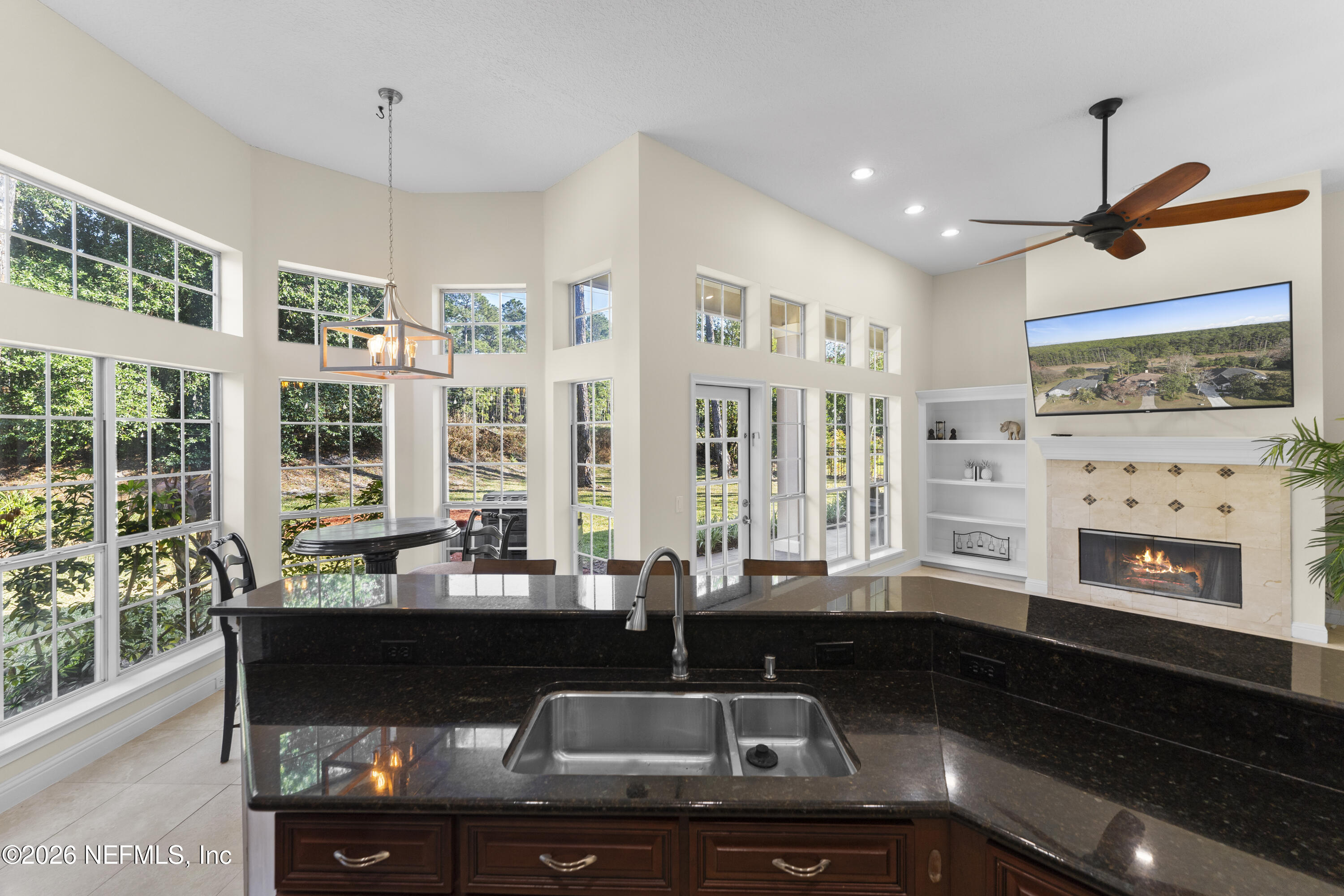 9957 Chelsea Lake Road Jacksonville, FL 32256 - Photo 15 of 73 a kitchen with granite countertop a sink and a counter top space
