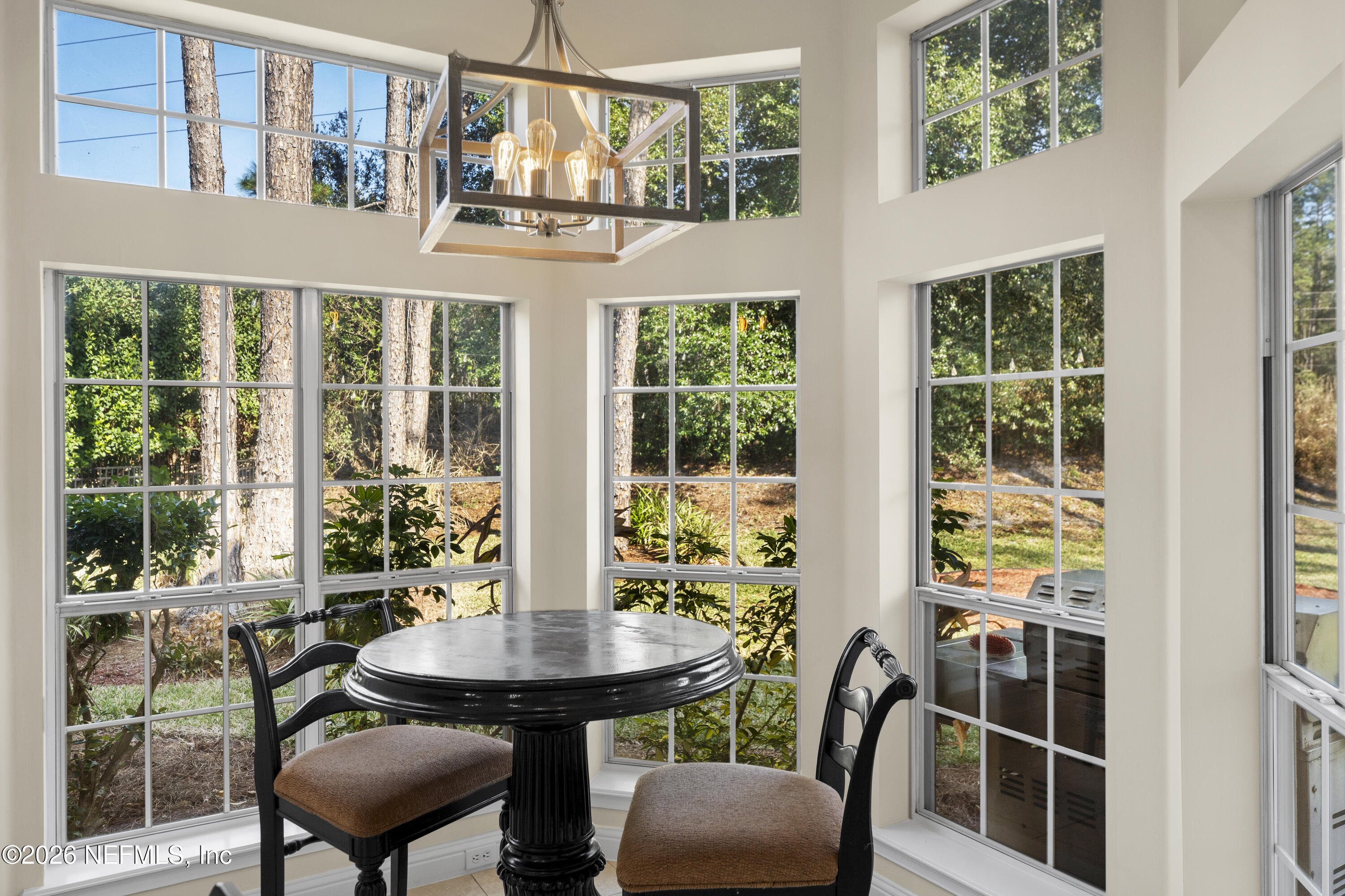 9957 Chelsea Lake Road Jacksonville, FL 32256 - Photo 17 of 73 a view of a dining room with furniture window and outside view