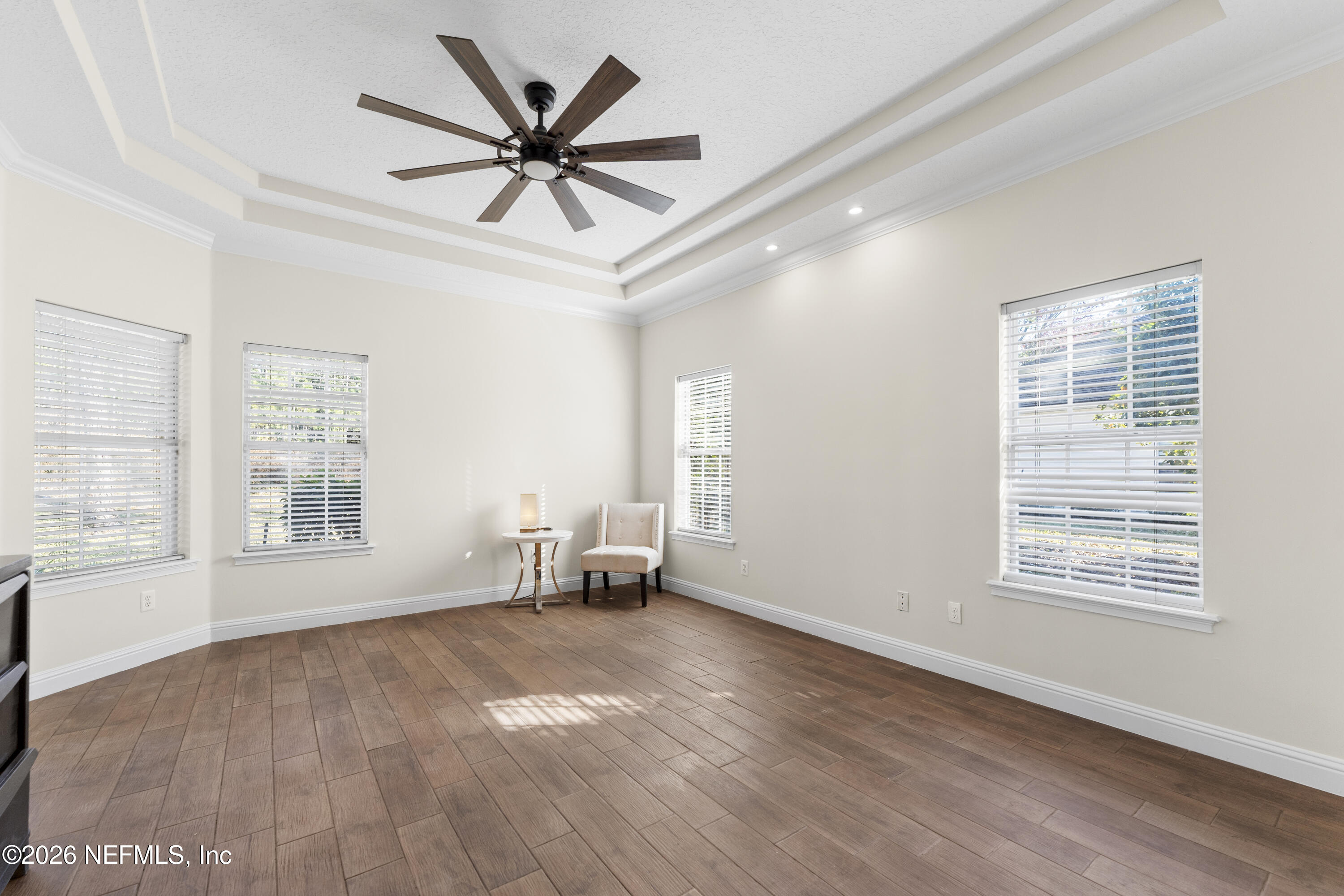 9957 Chelsea Lake Road Jacksonville, FL 32256 - Photo 21 of 73 wooden floor in an empty room with a window