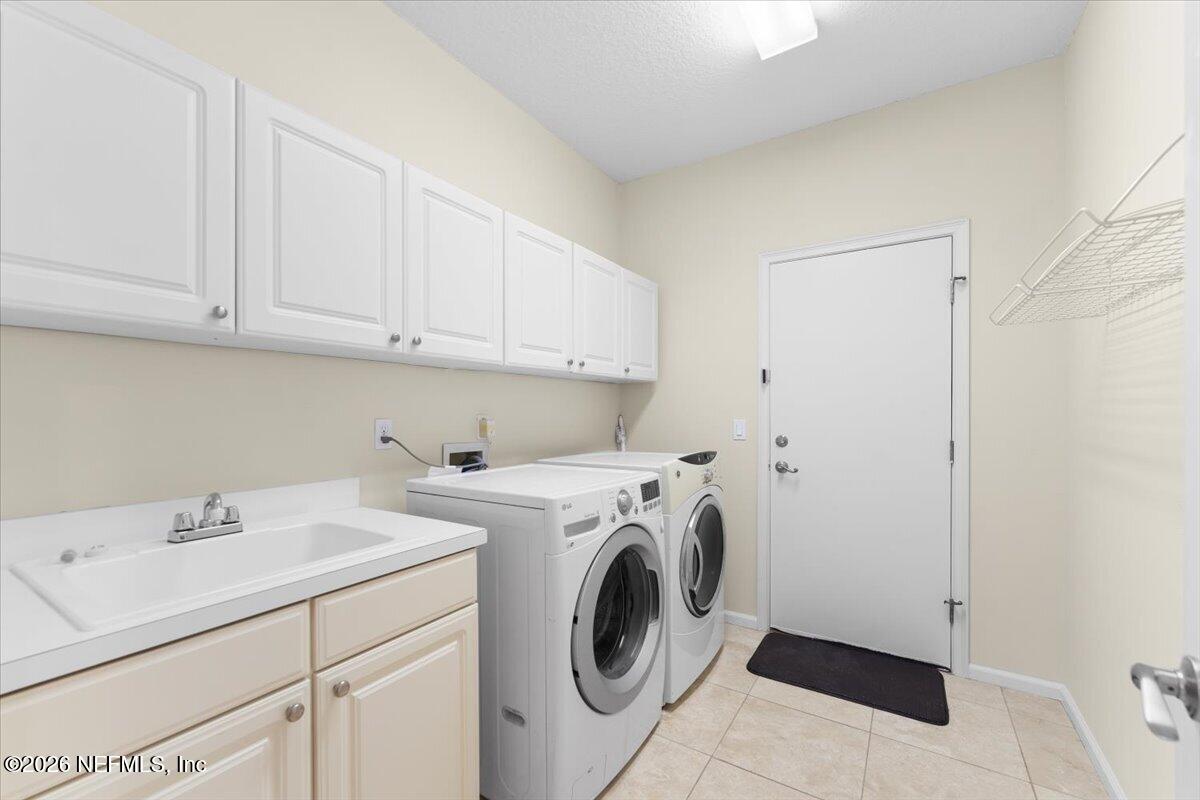 9957 Chelsea Lake Road Jacksonville, FL 32256 - Photo 29 of 73 a utility room with dryer and washer
