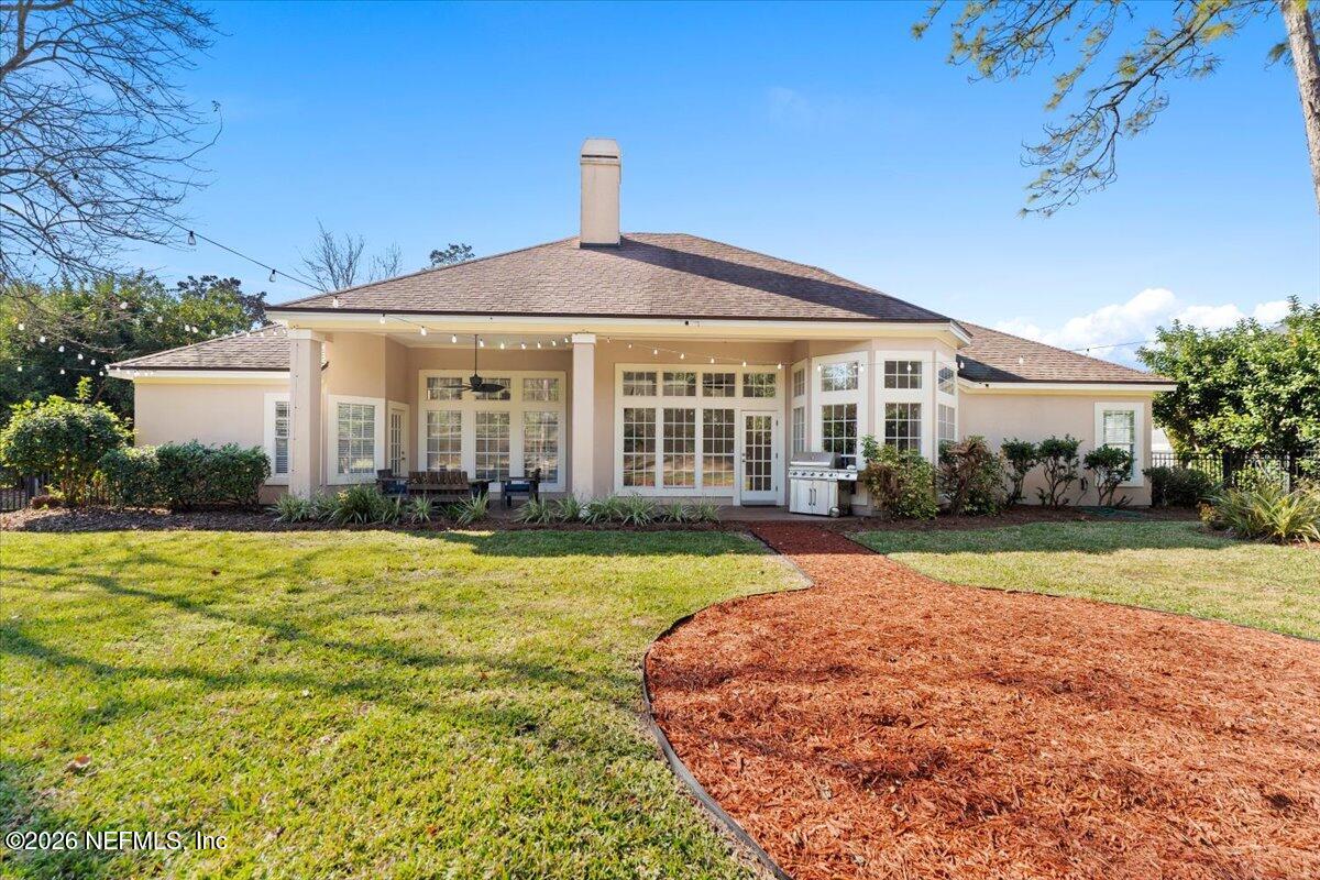 9957 Chelsea Lake Road Jacksonville, FL 32256 - Photo 36 of 73 a front view of a house with a yard