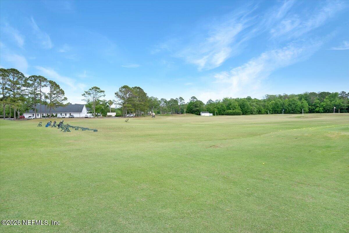 9957 Chelsea Lake Road Jacksonville, FL 32256 - Photo 46 of 73 a view of a field with trees in background