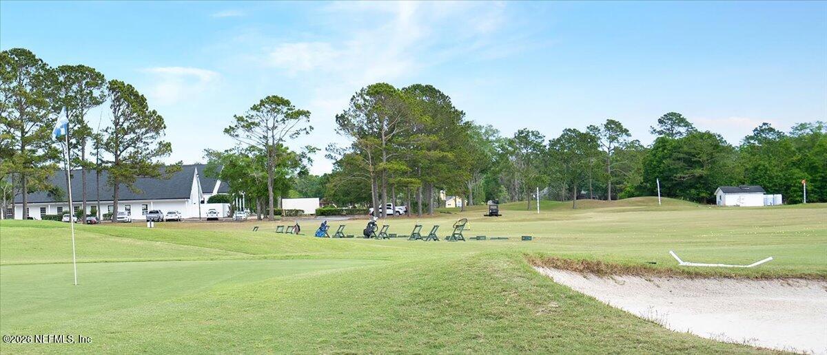 9957 Chelsea Lake Road Jacksonville, FL 32256 - Photo 48 of 73 a view of a playground with basketball court