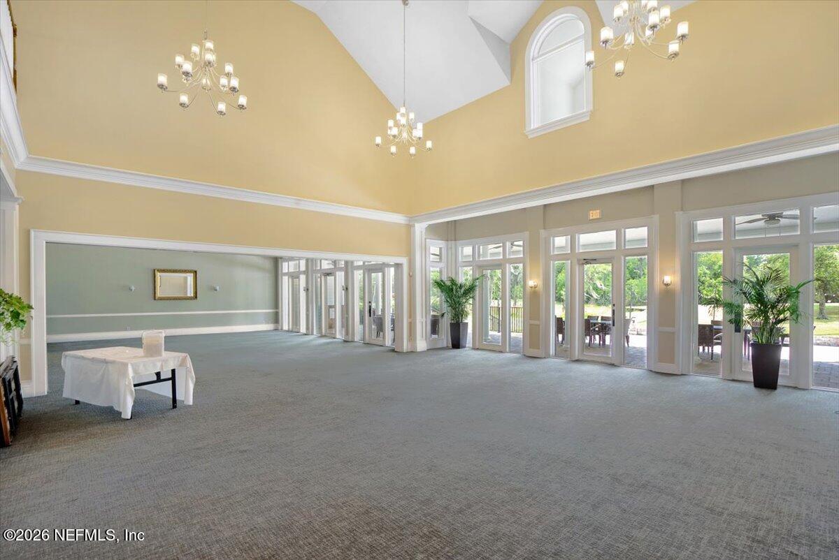 9957 Chelsea Lake Road Jacksonville, FL 32256 - Photo 52 of 73 a view of a room with furniture and chandelier