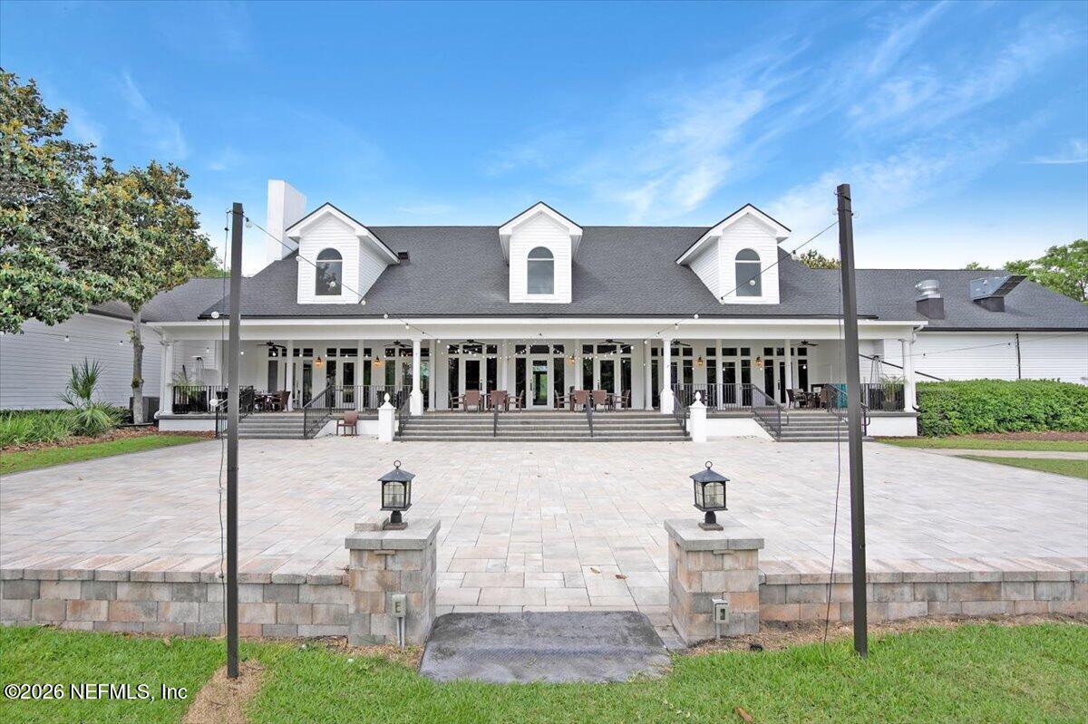 9957 Chelsea Lake Road Jacksonville, FL 32256 - Photo 63 of 73 a front view of a house with a yard