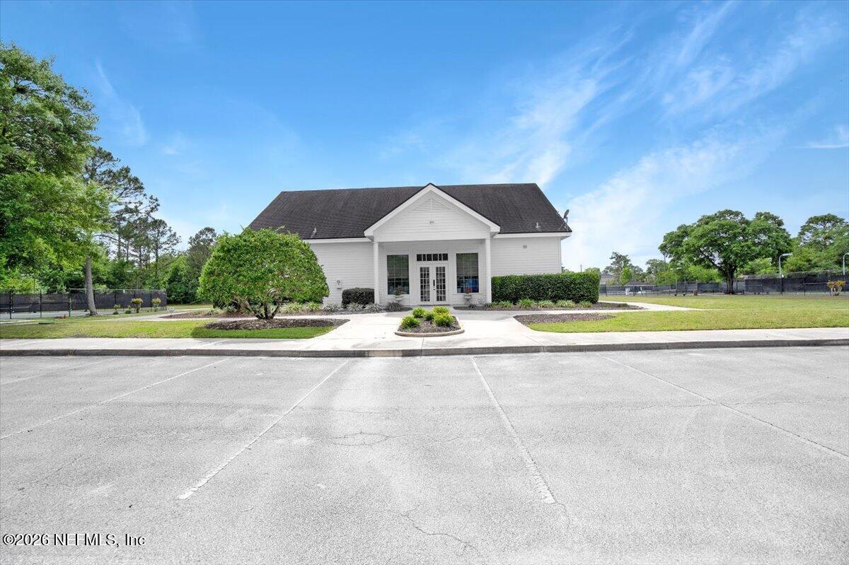 9957 Chelsea Lake Road Jacksonville, FL 32256 - Photo 65 of 73 a view of swimming pool with a garden and a small yard