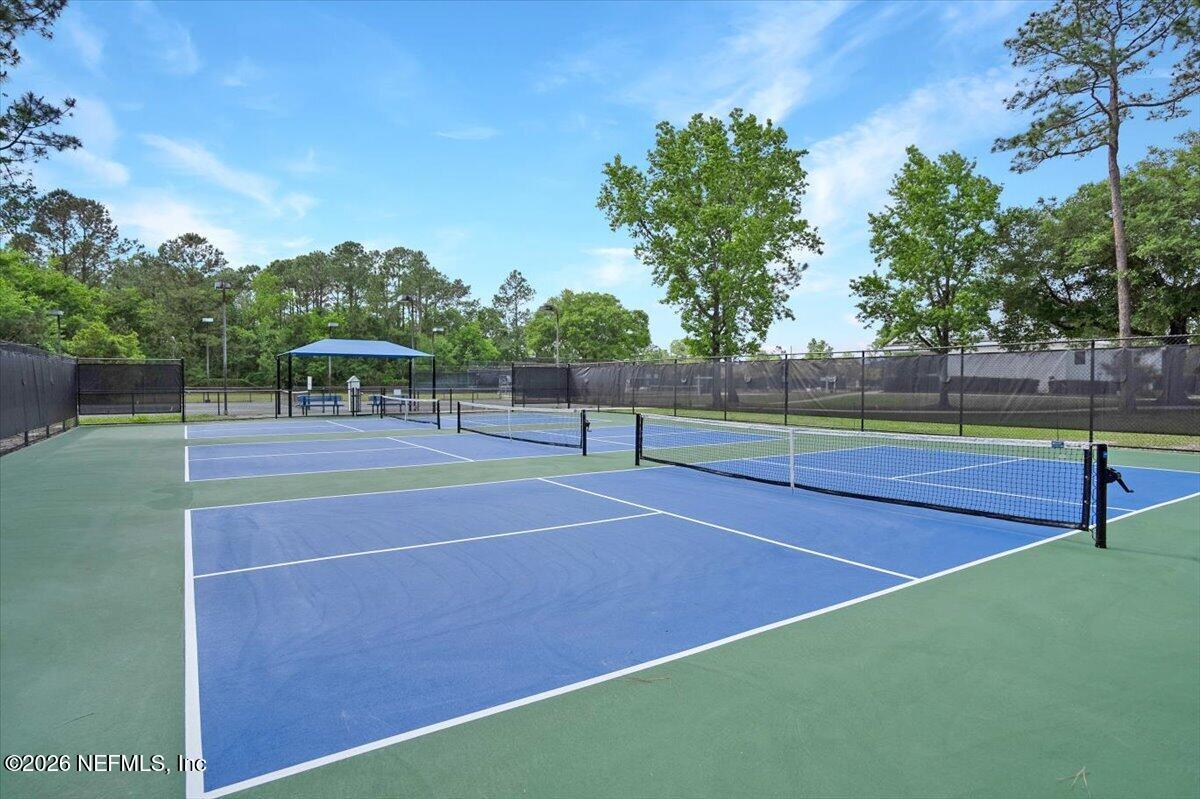 9957 Chelsea Lake Road Jacksonville, FL 32256 - Photo 66 of 73 a view of tennis court