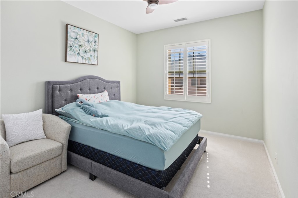 107 Overbrook Irvine, CA 92620 - Photo 12 of 47 a bedroom with a bed and a couch