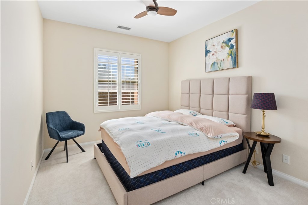 107 Overbrook Irvine, CA 92620 - Photo 13 of 47 a bed sitting in a spacious bedroom next to a window