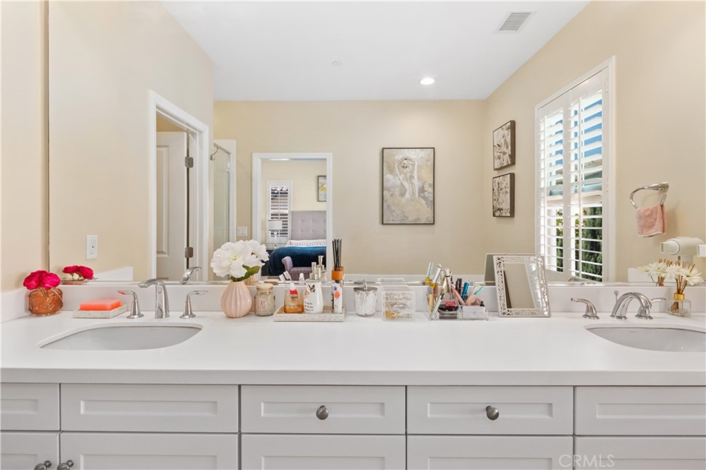 107 Overbrook Irvine, CA 92620 - Photo 17 of 47 a bathroom with a sink and a mirror