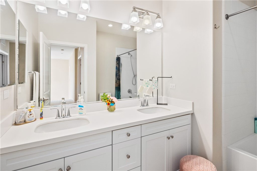 107 Overbrook Irvine, CA 92620 - Photo 18 of 47 a bathroom with a sink double vanity and a mirror