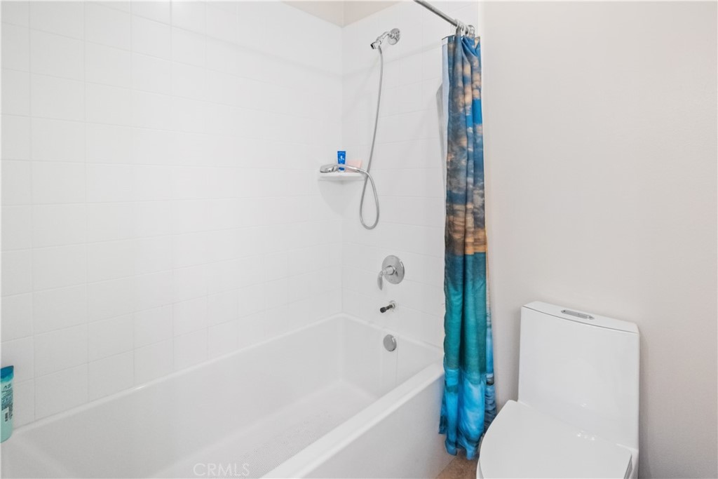 107 Overbrook Irvine, CA 92620 - Photo 20 of 47 a bathroom with a shower and a toilet