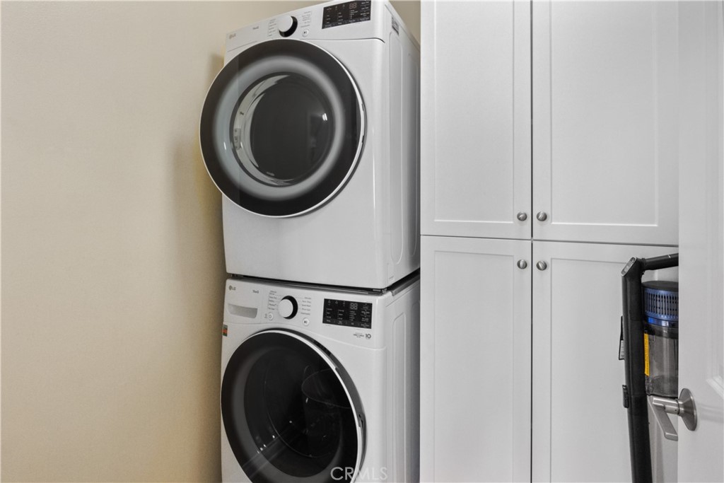 107 Overbrook Irvine, CA 92620 - Photo 21 of 47 a close up view of a washer and dryer