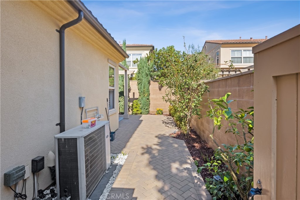 107 Overbrook Irvine, CA 92620 - Photo 25 of 47 a view of a pathway of house with potted plants