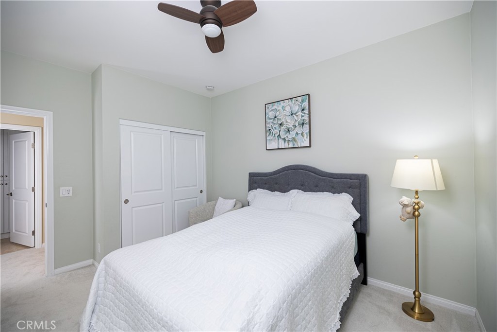 107 Overbrook Irvine, CA 92620 - Photo 33 of 47 a bedroom with a bed and a lamp