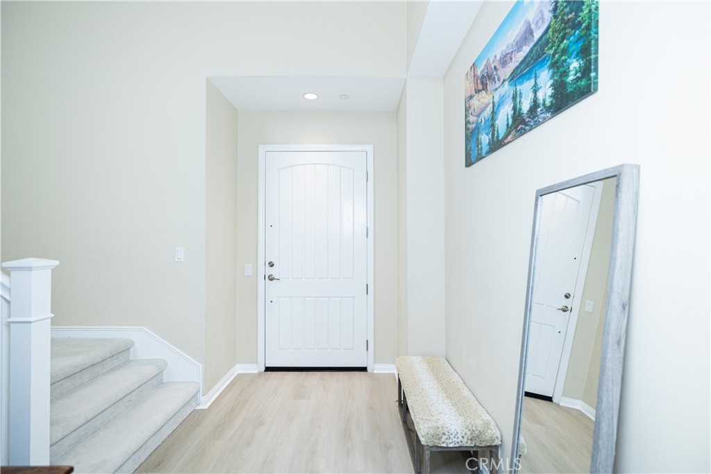 107 Overbrook Irvine, CA 92620 - Photo 36 of 47 a view of a hallway with furniture and entryway