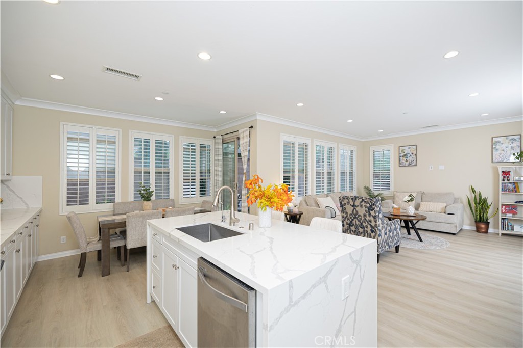 107 Overbrook Irvine, CA 92620 - Photo 41 of 47 a living room with furniture stove and wooden floor